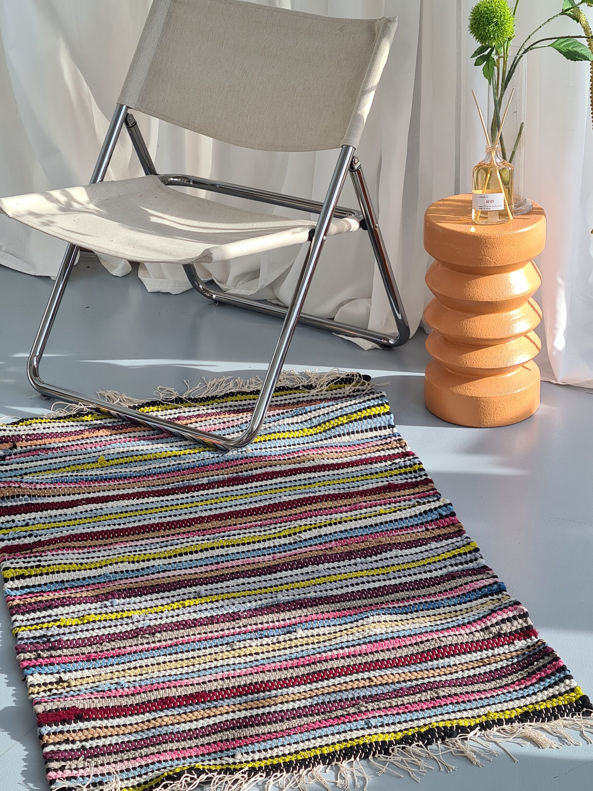 HAND WOVEN RUG MADE WITH UPCYCLED MATERIALS